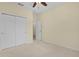 This cozy bedroom features neutral carpeting and paint, creating a warm and inviting atmosphere at 2424 Plumadore Dr, Grand Island, FL 32735