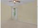 Bright bedroom featuring a window with sheer white curtains, offering natural light and a soft, airy feel at 2424 Plumadore Dr, Grand Island, FL 32735