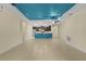 Bright living room showcasing an open floor plan connecting to a modern kitchen at 2424 Plumadore Dr, Grand Island, FL 32735