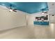 Spacious living room seamlessly connecting to the kitchen, featuring a breakfast bar and modern finishes at 2424 Plumadore Dr, Grand Island, FL 32735
