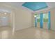 Bright and spacious living room featuring tile floors, large windows, and elegant lighting fixtures at 2424 Plumadore Dr, Grand Island, FL 32735