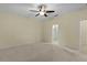 Spacious main bedroom with neutral carpet and an ensuite bathroom at 2424 Plumadore Dr, Grand Island, FL 32735