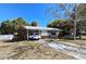 Charming single-story home featuring a carport, brick accents and a well-kept front lawn at 2501 Sheridan Rd, Mount Dora, FL 32757