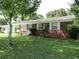 Charming brick home with a well-maintained lawn and inviting curb appeal at 2501 Sheridan Rd, Mount Dora, FL 32757