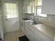 Practical kitchen design, featuring a stainless steel sink, and a convenient countertop area at 2501 Sheridan Rd, Mount Dora, FL 32757
