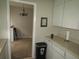 Open kitchen view into the dining area with stylish lighting and decor at 2501 Sheridan Rd, Mount Dora, FL 32757