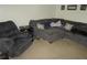 Cozy living room featuring comfortable seating and neutral carpeting at 2501 Sheridan Rd, Mount Dora, FL 32757