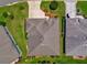 Aerial view of a well-maintained home with manicured lawn, and a symmetrical roof design at 2568 Jupiter Way, The Villages, FL 32163