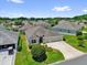 Charming single-story home featuring a well-manicured lawn, lovely landscaping, and a spacious driveway at 2568 Jupiter Way, The Villages, FL 32163