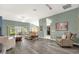 Spacious living room with stylish flooring, modern lighting, and open layout perfect for entertaining at 2568 Jupiter Way, The Villages, FL 32163