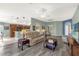 Open-concept living room seamlessly connecting to the kitchen and dining area, perfect for Gathering gatherings at 2568 Jupiter Way, The Villages, FL 32163