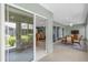 Enclosed patio featuring glass sliders offering views to the backyard and interior spaces at 2568 Jupiter Way, The Villages, FL 32163