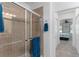 Bathroom showcases a glass shower door and access to the main bedroom at 26822 Bull Run, Leesburg, FL 34748