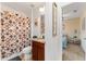 Bathroom featuring decorative shower curtain, and vanity with view to bedroom with decor at 26822 Bull Run, Leesburg, FL 34748