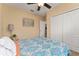 Bright bedroom features double door closet, complimented by neutral walls and light decor at 26822 Bull Run, Leesburg, FL 34748
