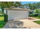 Spacious two-car garage and well-manicured landscaping at this cozy home at 26822 Bull Run, Leesburg, FL 34748