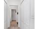 Neutral hallway provides multiple closets and access to other rooms at 26822 Bull Run, Leesburg, FL 34748