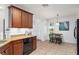 This cozy kitchen features granite counters and dark wooden cabinetry at 26822 Bull Run, Leesburg, FL 34748