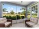 Relaxing screened lanai features comfortable seating and expansive golf course views at 26822 Bull Run, Leesburg, FL 34748