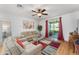 Comfortable living room with hardwood floors and a sliding door to an outdoor space at 26822 Bull Run, Leesburg, FL 34748