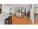 View from living room shows kitchen and breakfast bar, plus dining space at 26822 Bull Run, Leesburg, FL 34748