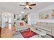 Open living room features hardwood floors and seamless access to the kitchen at 26822 Bull Run, Leesburg, FL 34748