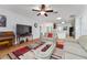 Inviting living room features hardwood floors, ceiling fan, and seamless kitchen access at 26822 Bull Run, Leesburg, FL 34748