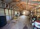 Spacious barn interior with wooden beams, metal walls and plenty of potential for storage or workshop at 27610 Debbie Rd, Okahumpka, FL 34762