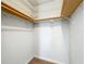 Walk-in closet with shelving, providing ample storage space at 27610 Debbie Rd, Okahumpka, FL 34762