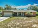 Charming brick home with a well-maintained lawn and a two-car garage at 27610 Debbie Rd, Okahumpka, FL 34762