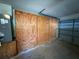 Spacious garage featuring built-in plywood shelving offering ample storage at 27610 Debbie Rd, Okahumpka, FL 34762