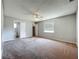 Spacious main bedroom with a ceiling fan, closet, and ensuite bathroom at 27610 Debbie Rd, Okahumpka, FL 34762
