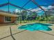 Sparkling pool with a screened enclosure, backing up to a lovely yard at 27610 Debbie Rd, Okahumpka, FL 34762