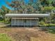 A charming shed is securely fenced to prevent outside access at 27610 Debbie Rd, Okahumpka, FL 34762