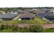 Aerial view of the back of the house and the screened-in lanai at 2988 Sentell St, The Villages, FL 32163