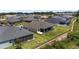 An aerial view of a home featuring a screened lanai at 2988 Sentell St, The Villages, FL 32163