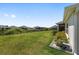 An expansive green lawn with a neighboring fence line at 2988 Sentell St, The Villages, FL 32163