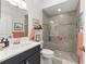Updated bathroom with a large shower, glass doors, modern sink, and fixtures at 2988 Sentell St, The Villages, FL 32163