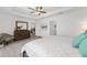 Spacious bedroom featuring a ceiling fan, wood furniture and a neutral palette to customize your space at 2988 Sentell St, The Villages, FL 32163