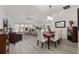 Open-concept living and dining area featuring modern furnishings, neutral colors, and natural light at 2988 Sentell St, The Villages, FL 32163