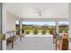 Screened-in lanai with views of the landscaped backyard and community at 2988 Sentell St, The Villages, FL 32163