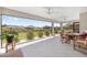 Spacious screened-in lanai with views of the lush green landscaping and neighborhood at 2988 Sentell St, The Villages, FL 32163