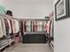 Organized walk-in closet provides ample storage with rods, shelves, and a center drawer unit at 2988 Sentell St, The Villages, FL 32163
