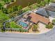 Bird's eye view showcases a fenced-in backyard with a screened pool and spa, and pond views at 2998 Kramer Ct, The Villages, FL 32163
