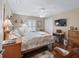 Inviting bedroom with natural light, ceiling fan, and charming decorative accents at 2998 Kramer Ct, The Villages, FL 32163