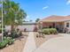 Charming home boasts a lush front yard with stone accents and meticulous landscaping at 2998 Kramer Ct, The Villages, FL 32163