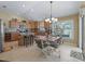 Bright kitchen features a center island, stainless appliances, and a cozy breakfast nook at 2998 Kramer Ct, The Villages, FL 32163