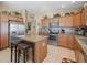 Spacious kitchen featuring stainless steel appliances, granite countertops, and a convenient center island at 2998 Kramer Ct, The Villages, FL 32163