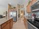 Spacious kitchen with stainless steel appliances and granite countertops, flowing into adjacent living spaces at 2998 Kramer Ct, The Villages, FL 32163
