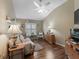 Comfortable living room with cozy seating, lamps, and a window with natural light at 2998 Kramer Ct, The Villages, FL 32163